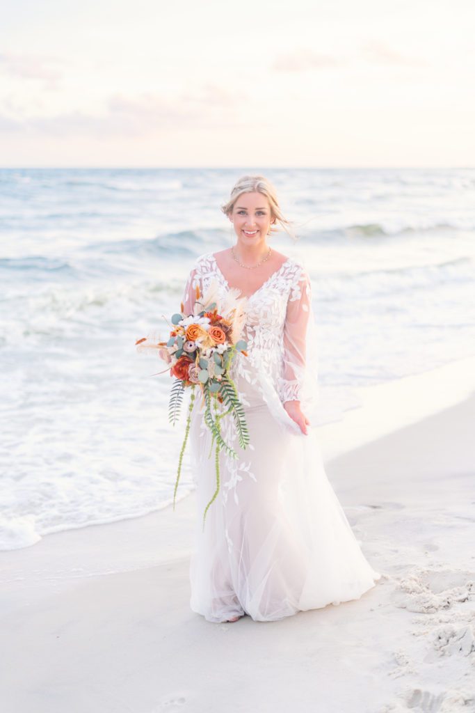 bridal portraits on the beach after beach ceremony